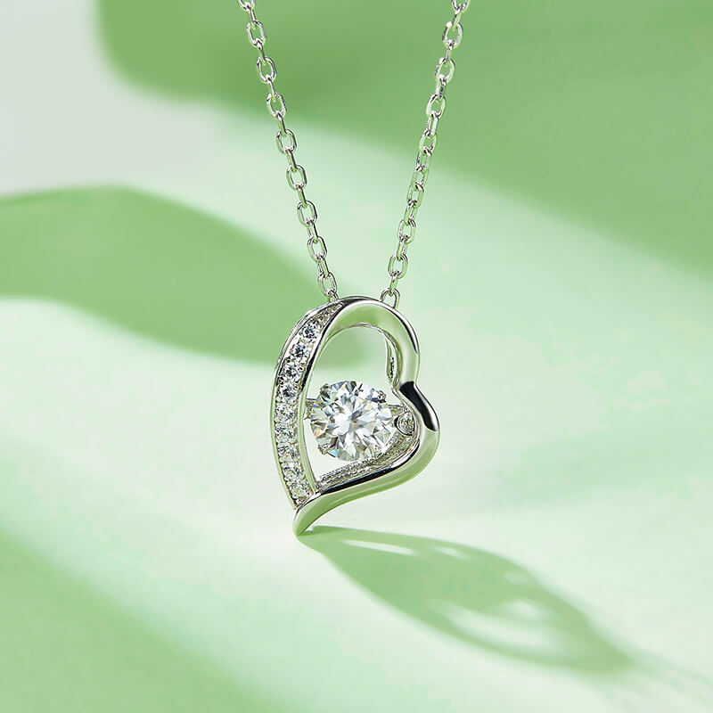 Dancing Moissanite Heart-Shaped Side Stone Necklace in Sterling Silver