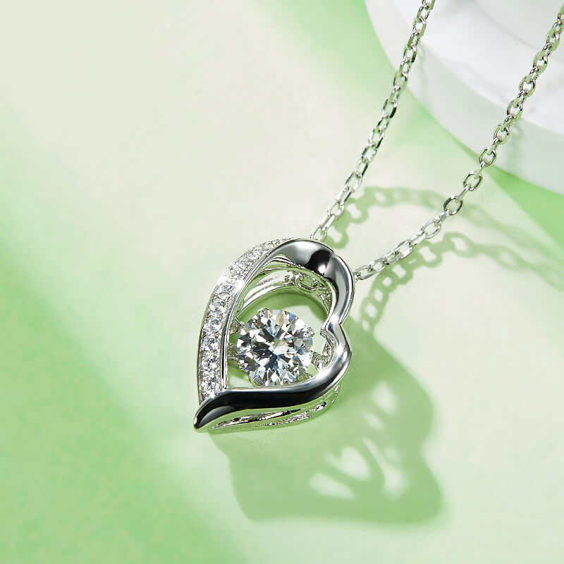 Dancing Moissanite Heart-Shaped Side Stone Necklace in Sterling Silver