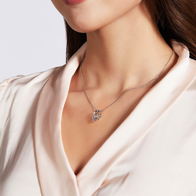 Dancing Moissanite Heart-Shaped Side Stone Necklace in Sterling Silver