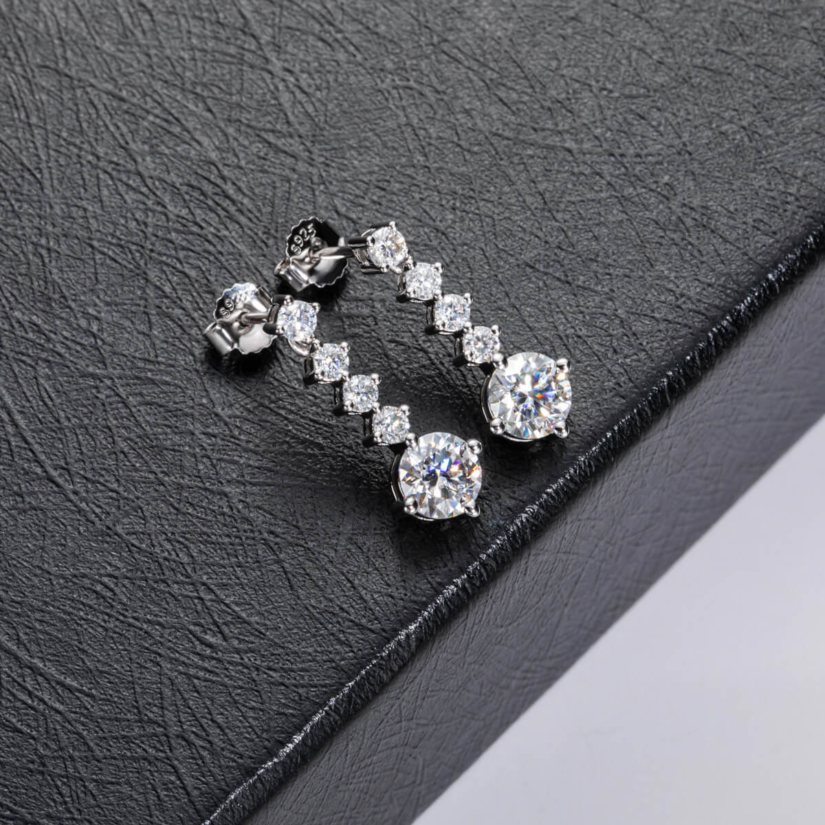 Graduated Linear Moissanite Drop Earrings In Sterling Silver