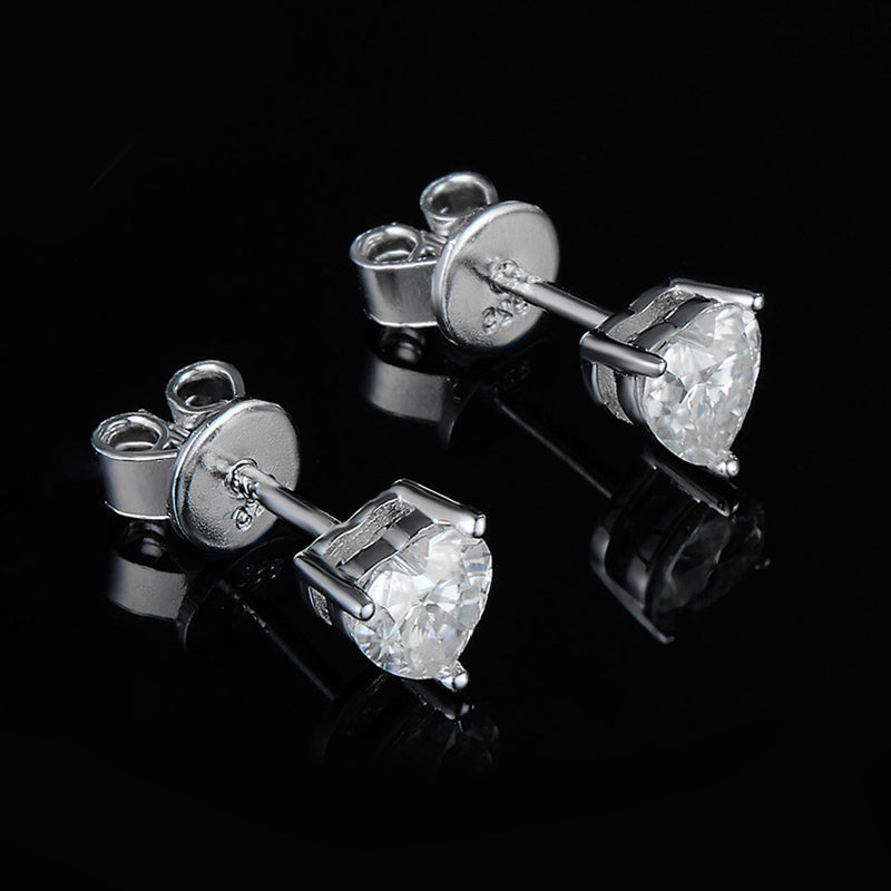 Solitaire Heart Cut Moissanite Three Prong Stud Earrings In Sterling Silver