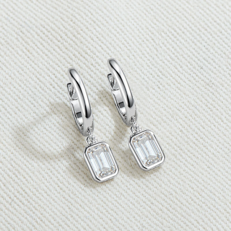 Solitaire Bezel Emerald-Cut Moissanite Drop Earrings In Sterling Silver